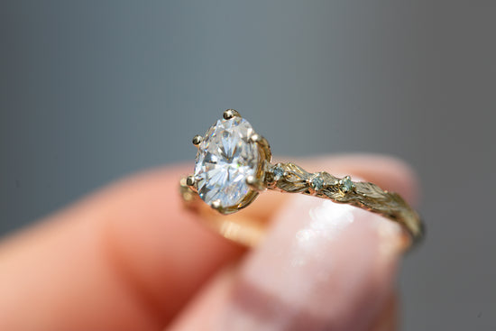 Rowan setting with oval moissanite and mint diamonds