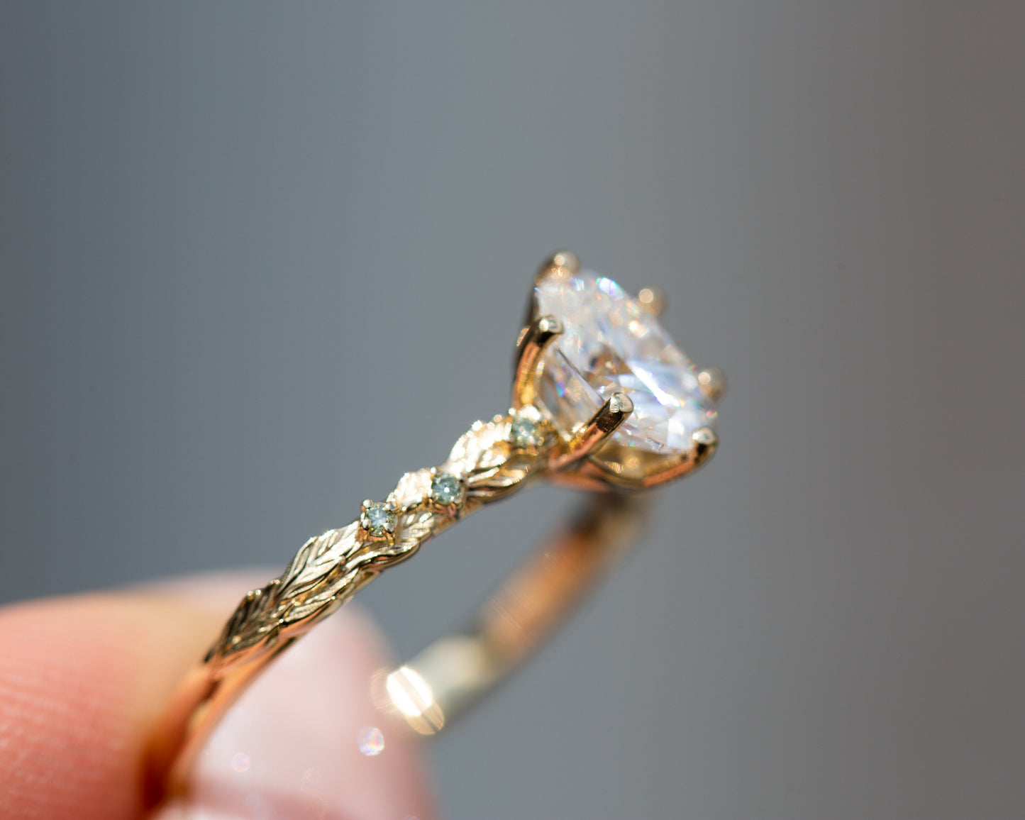 Rowan setting with oval moissanite and mint diamonds
