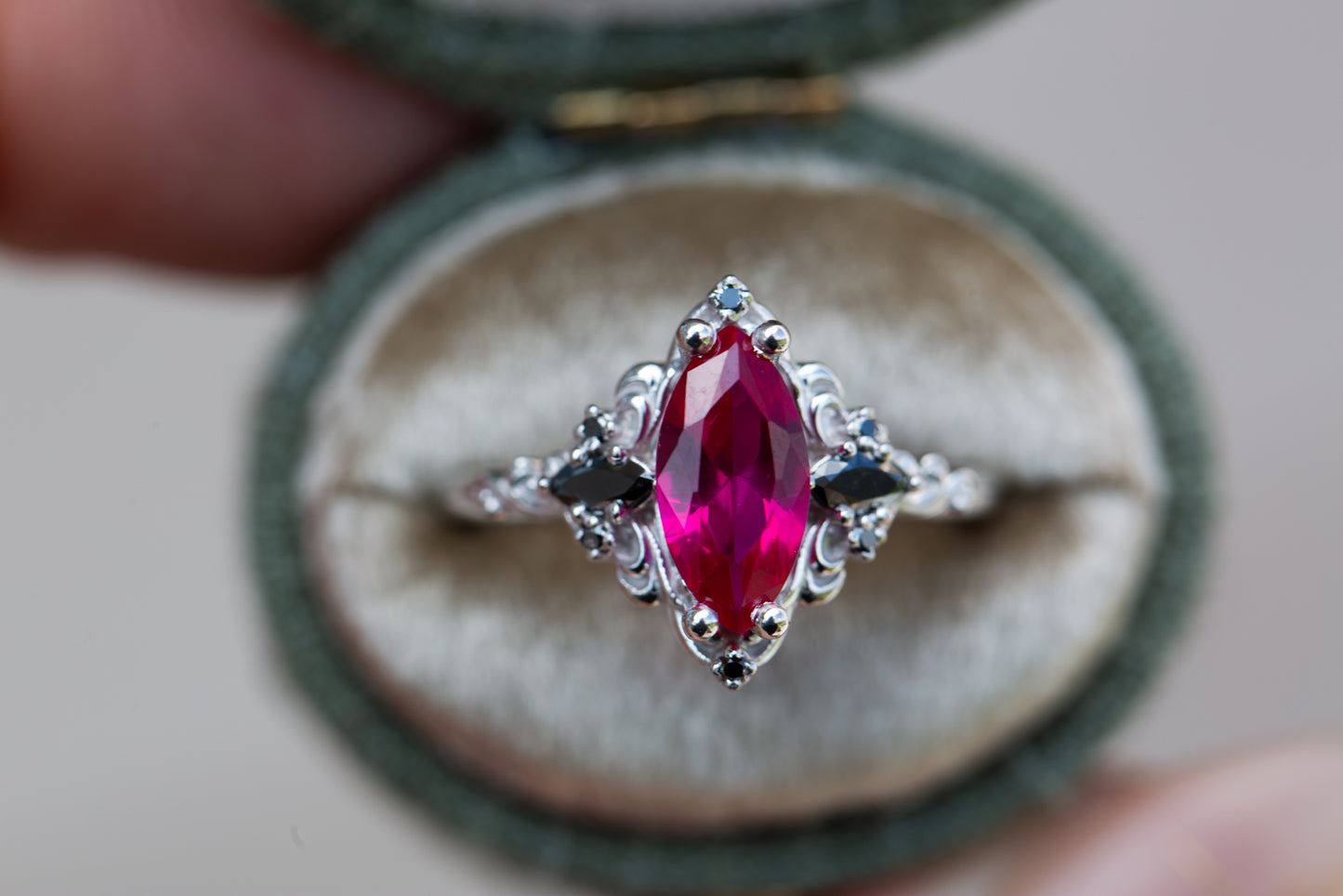 Aurora three stone with marquise lab ruby and black diamonds