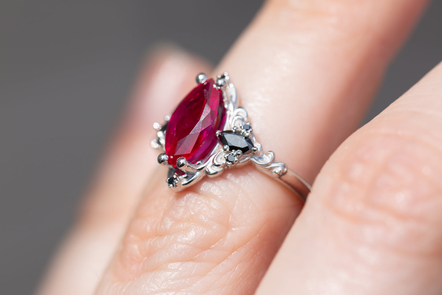 Aurora three stone with marquise lab ruby and black diamonds