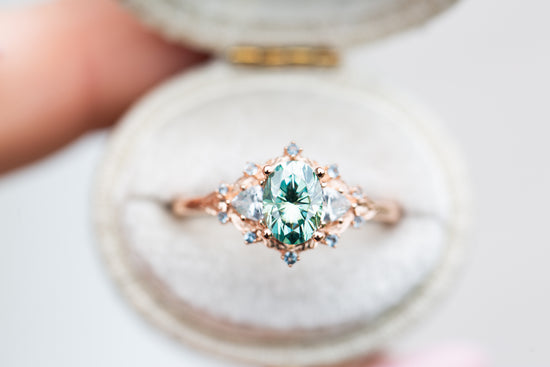 Woodland three stone with teal moissanite and aqua accents
