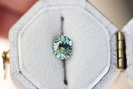 .98ct oval parti teal yellow sapphire