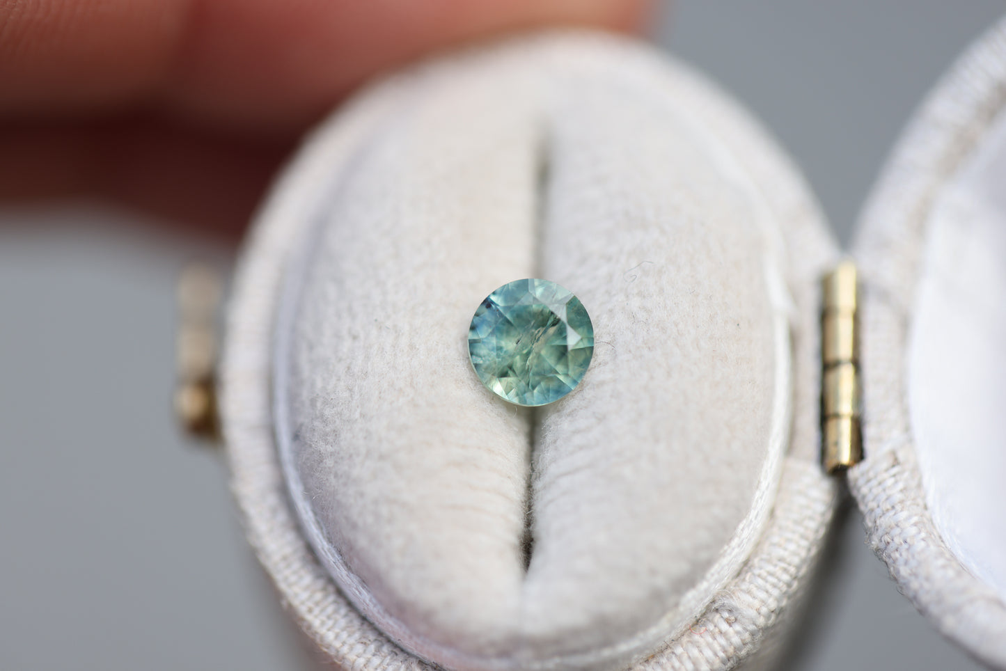 .73ct round teal green sapphire