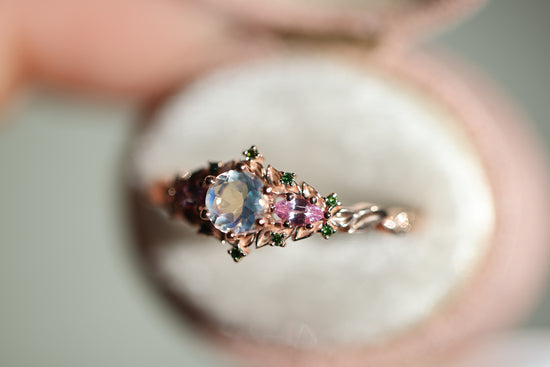 Briar rose three stone with 5mm round moonstone and pink sapphire/green diamond accents
