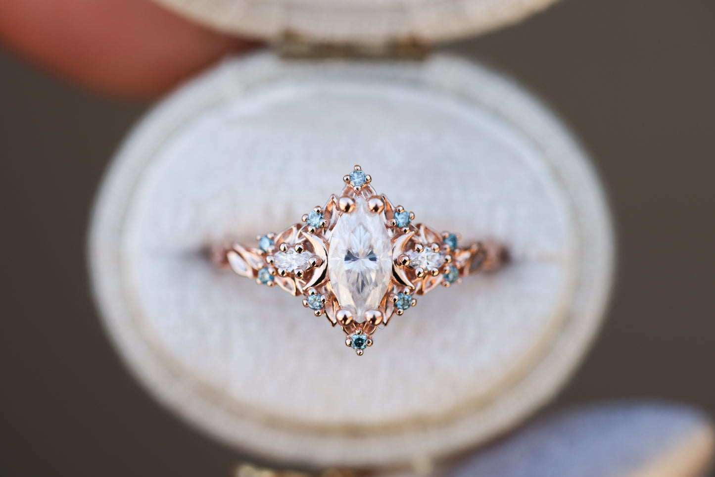 Briar moon with marquise moissanite center and aqua diamond accents