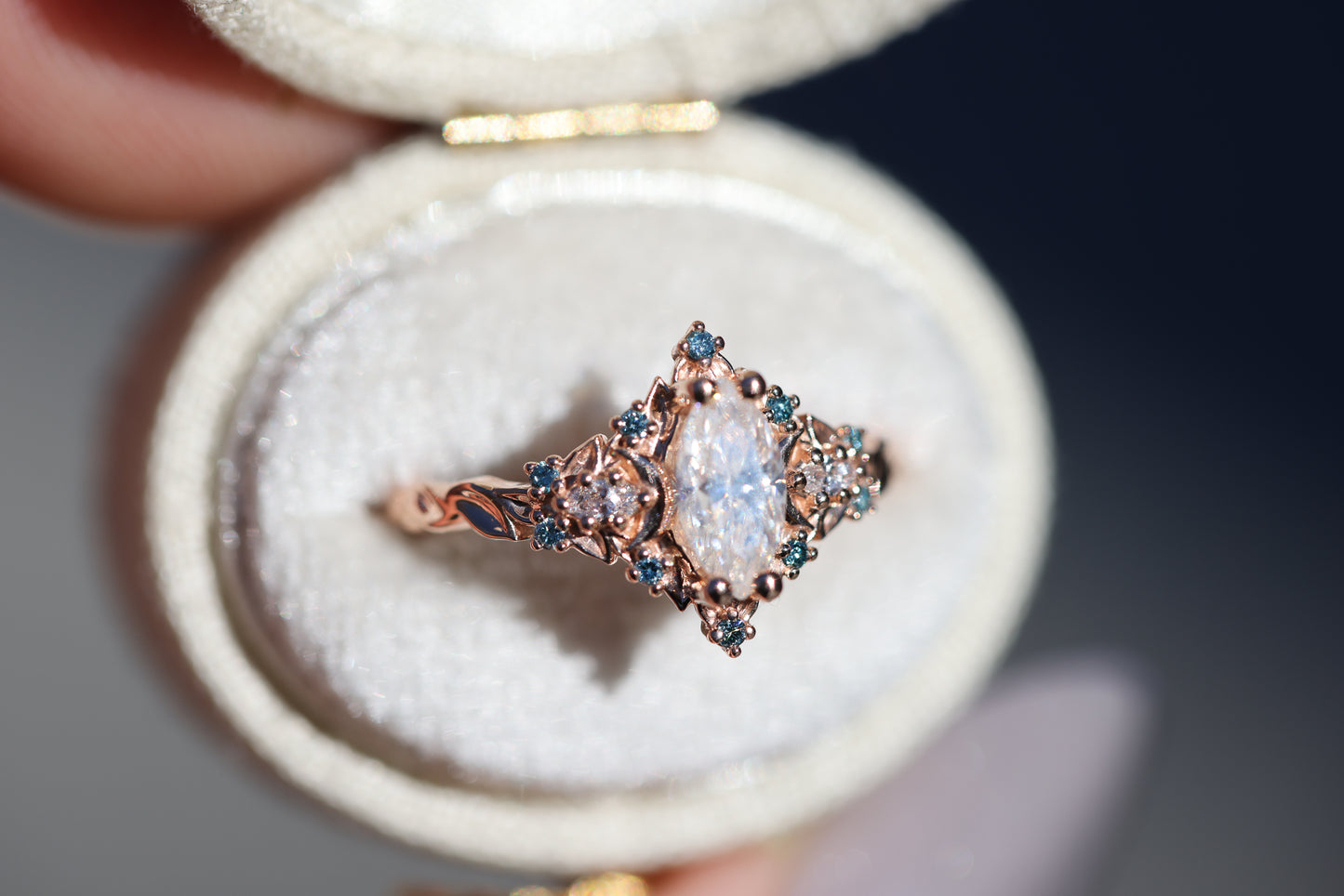 Briar moon with marquise moissanite center and aqua diamond accents