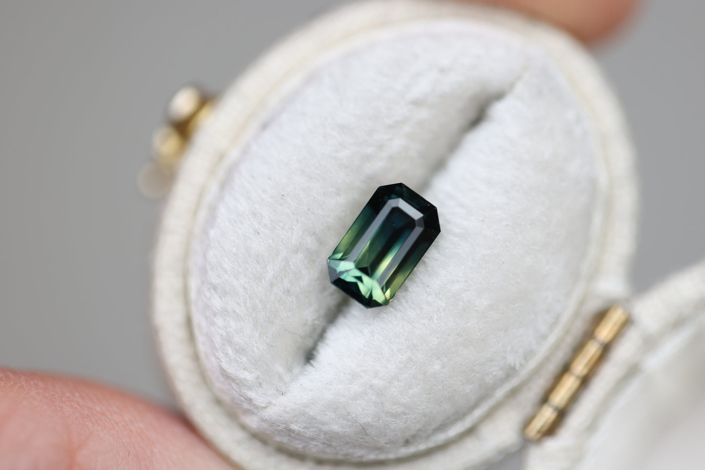 1.65ct emerald cut parti sapphire