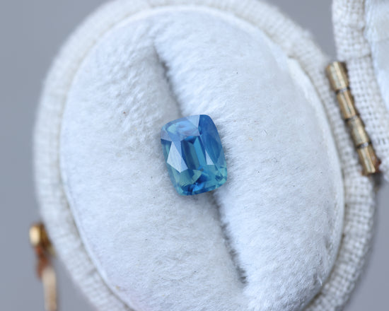 1.1ct cushion cut opalescent blue teal sapphire