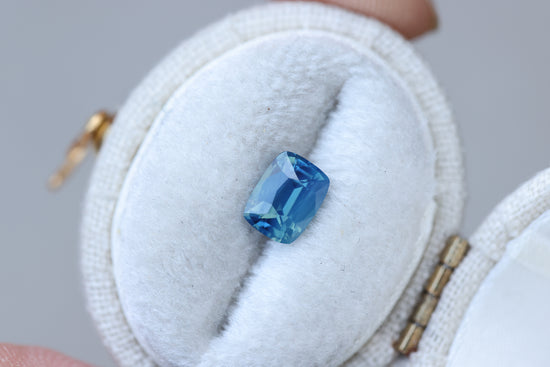 1.1ct cushion cut opalescent blue teal sapphire