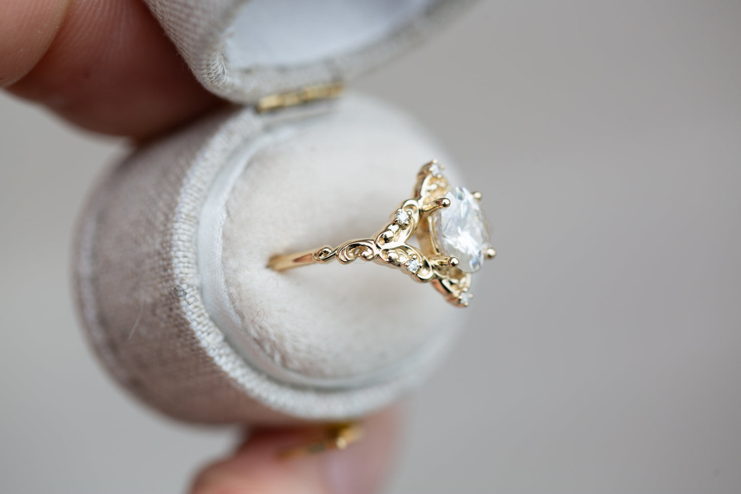 The Aurora setting with oval moissanite