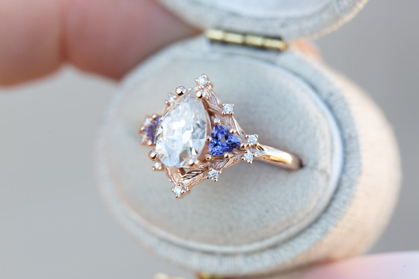 Woodland three stone with pear moissanite and tanzanite