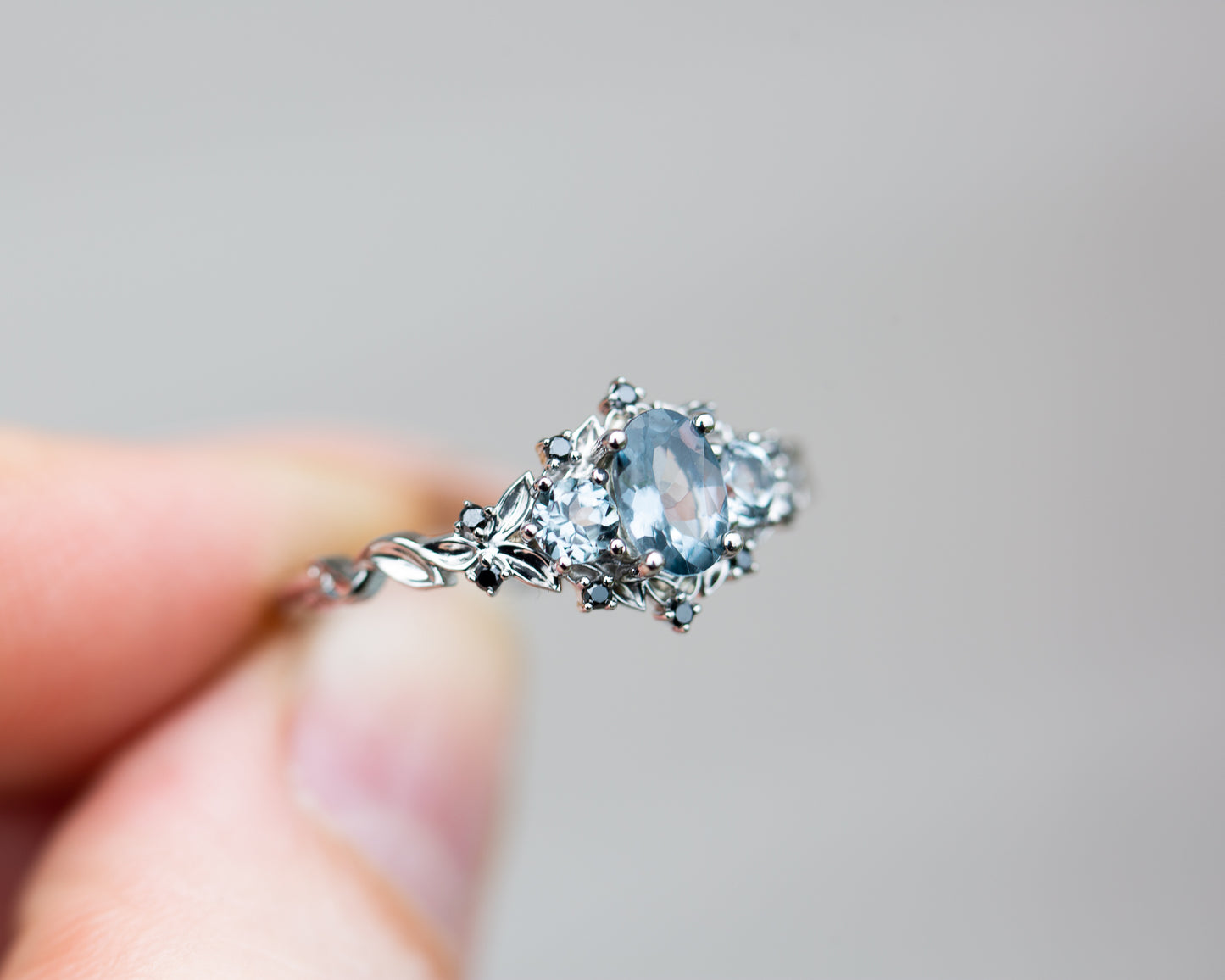 Briar rose three stone with grey spinel and black diamonds