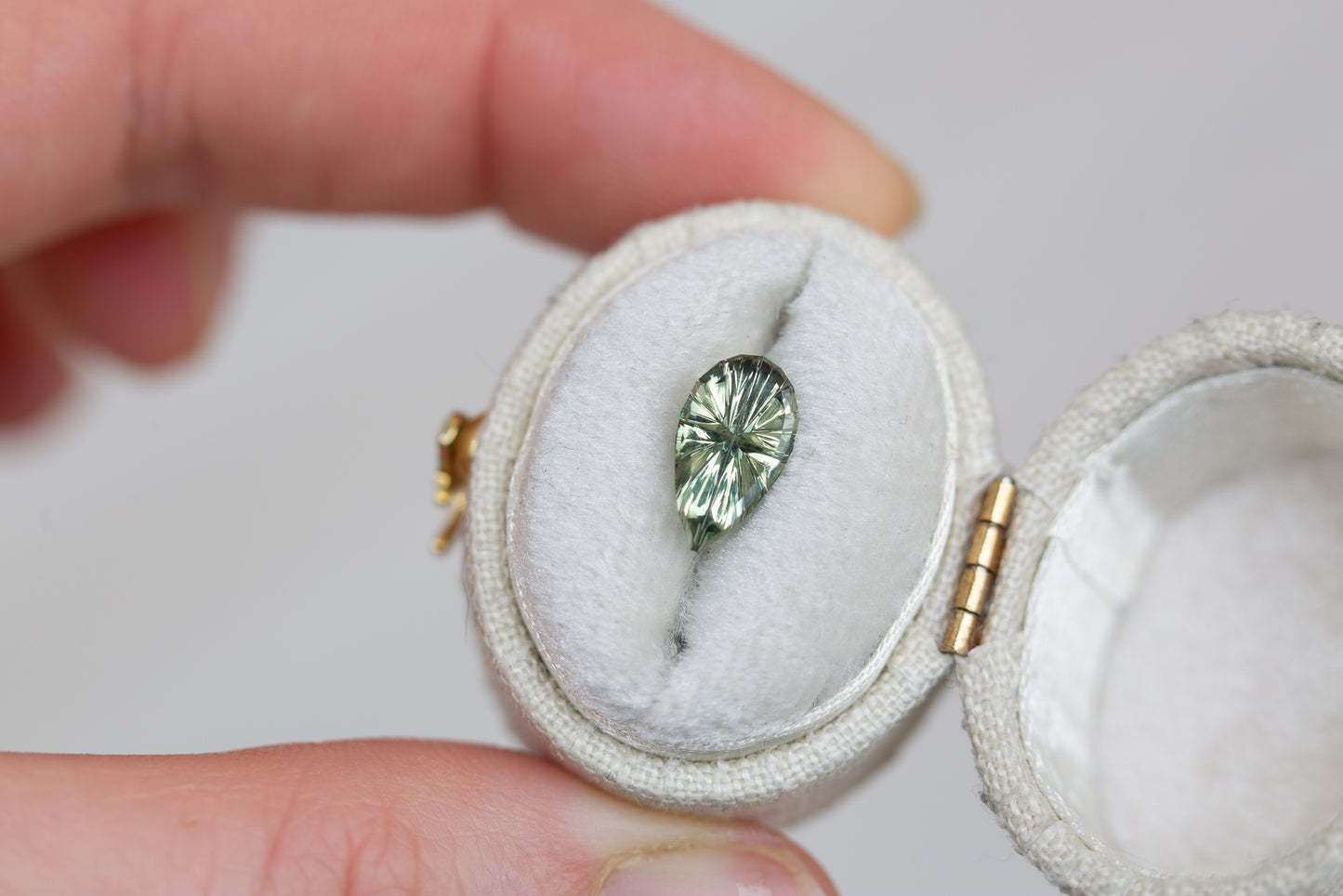 ON HOLD - 1.38ct pear green sapphire- Starbrite cut from John Dyer