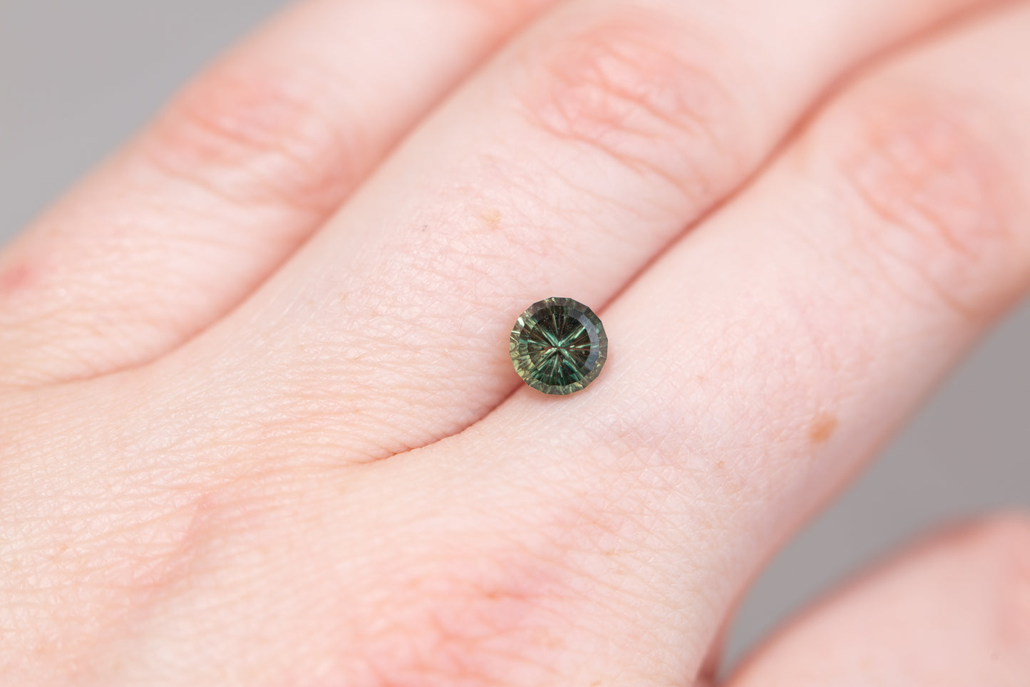 1.49ct parti darker green round StarBrite sapphire- Cut by John Dyer