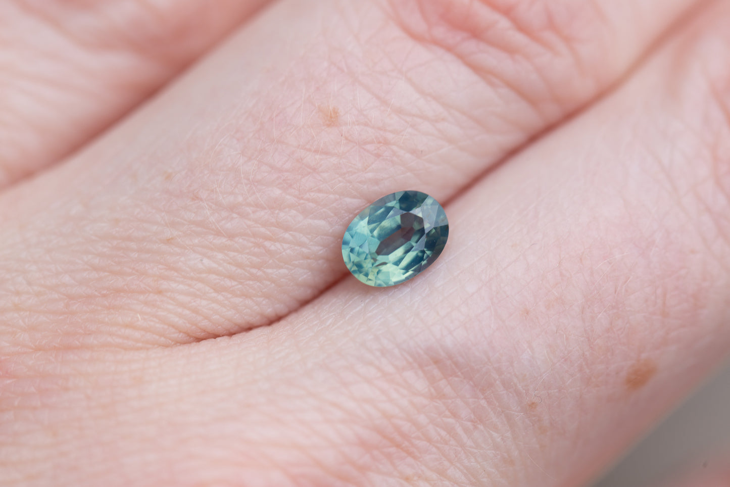 1.12ct oval opalescent teal sapphire
