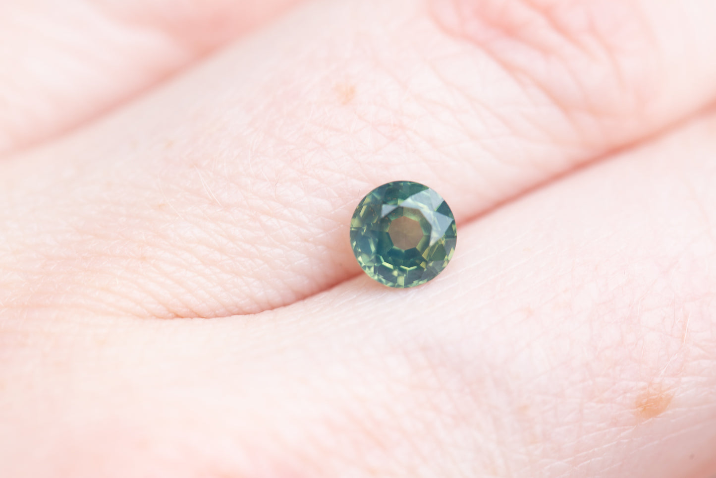 1.35ct round opalescent green teal sapphire