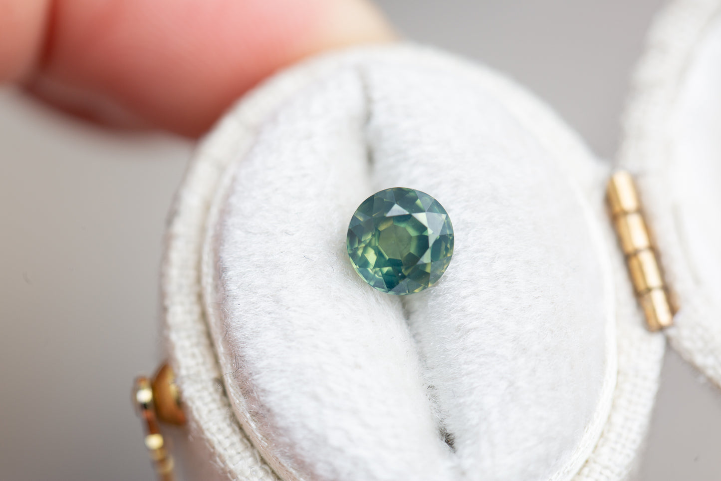 1.35ct round opalescent green teal sapphire