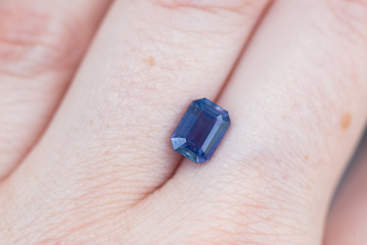 2.05ct emerald cut opalescent blue purple sapphire