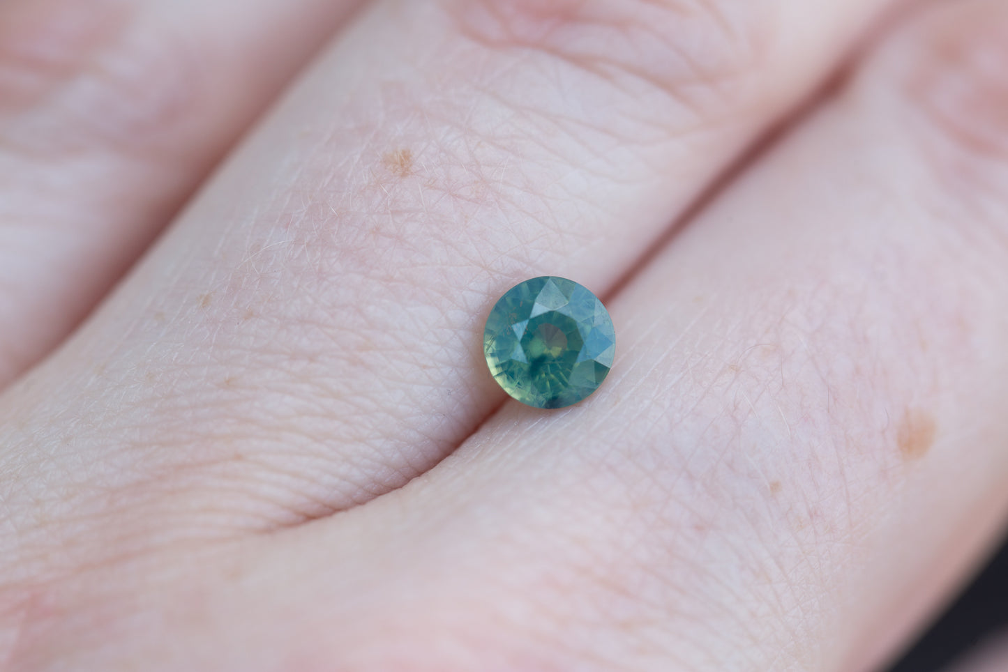 1.13ct round opalescent teal green sapphire