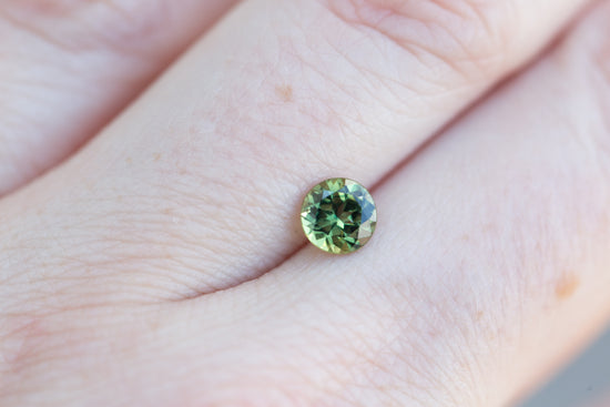 1.1ct round bright green yellow sapphire