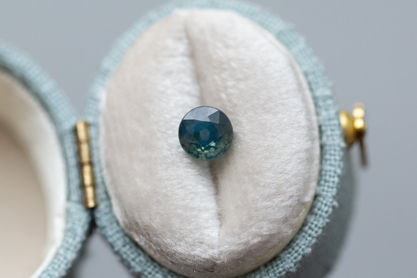 1.12ct Round Opalescent Blue and Sea Foam Green Sapphire