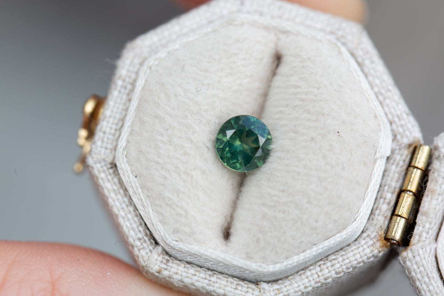 .75ct round teal green sapphire