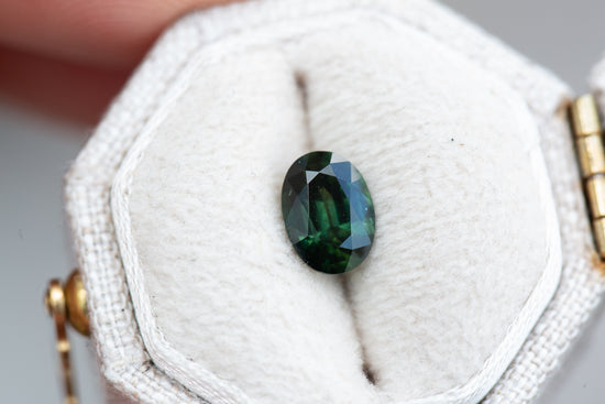 1.12ct oval dark green sapphire