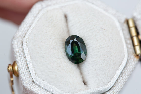 1.12ct oval dark green sapphire