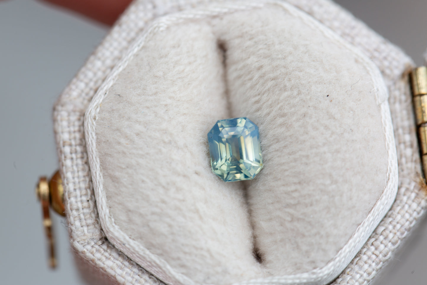 .7ct emerald cut opalescent teal sapphire