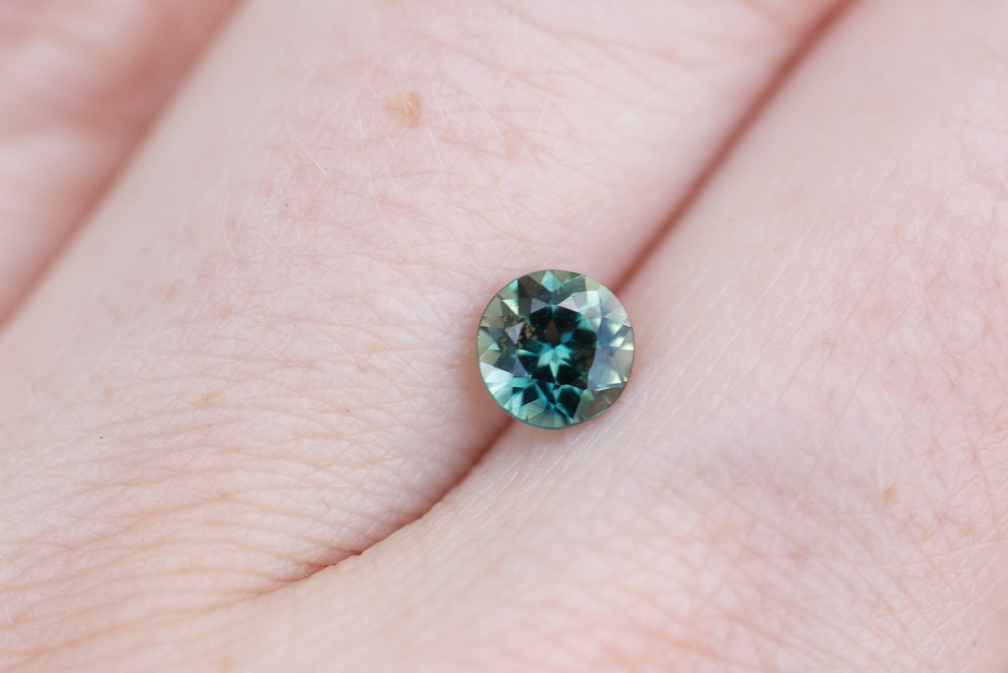 .86ct round teal green sapphire