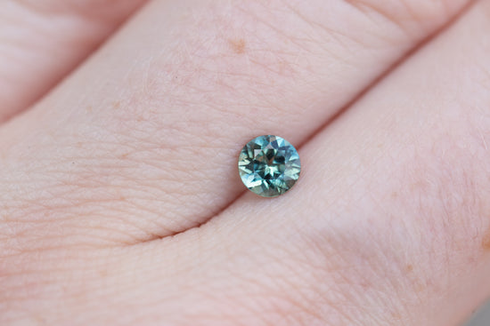 .57ct round teal blue sapphire