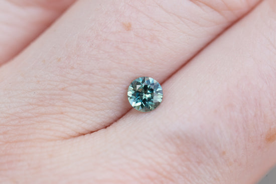 .57ct round teal blue sapphire