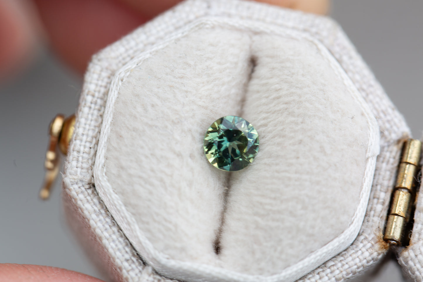 .59ct round teal green sapphire