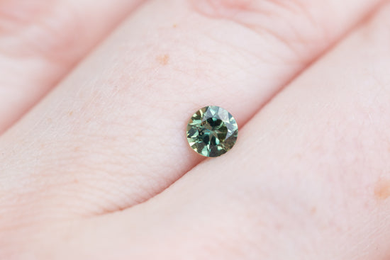 .59ct round teal green sapphire