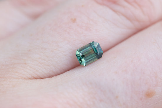 Load image into Gallery viewer, .81ct emerald cut teal green sapphire

