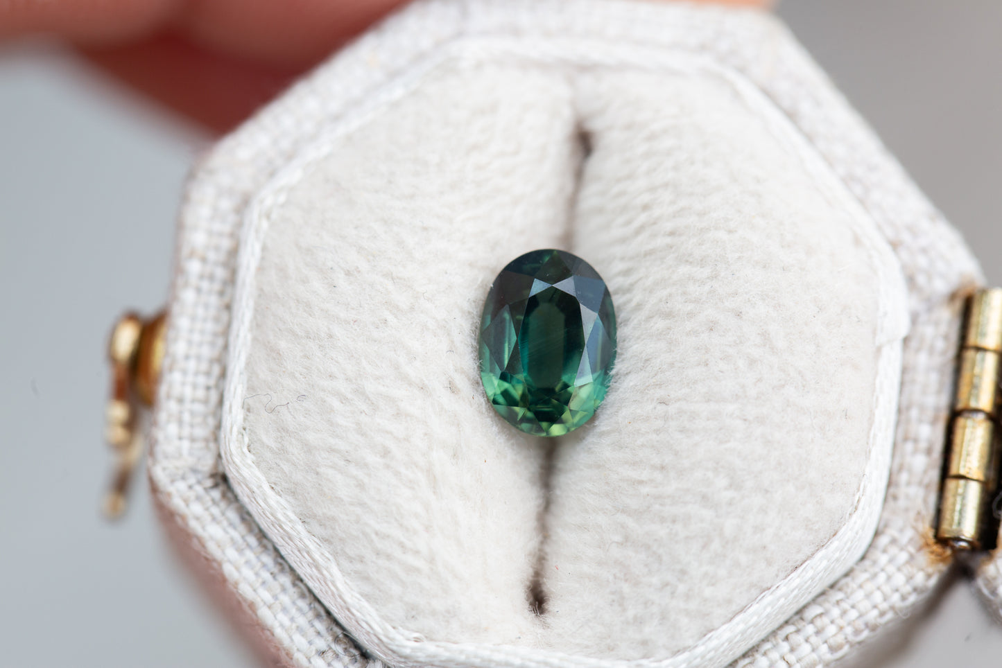 1.1ct oval deep green hint of blue sapphire