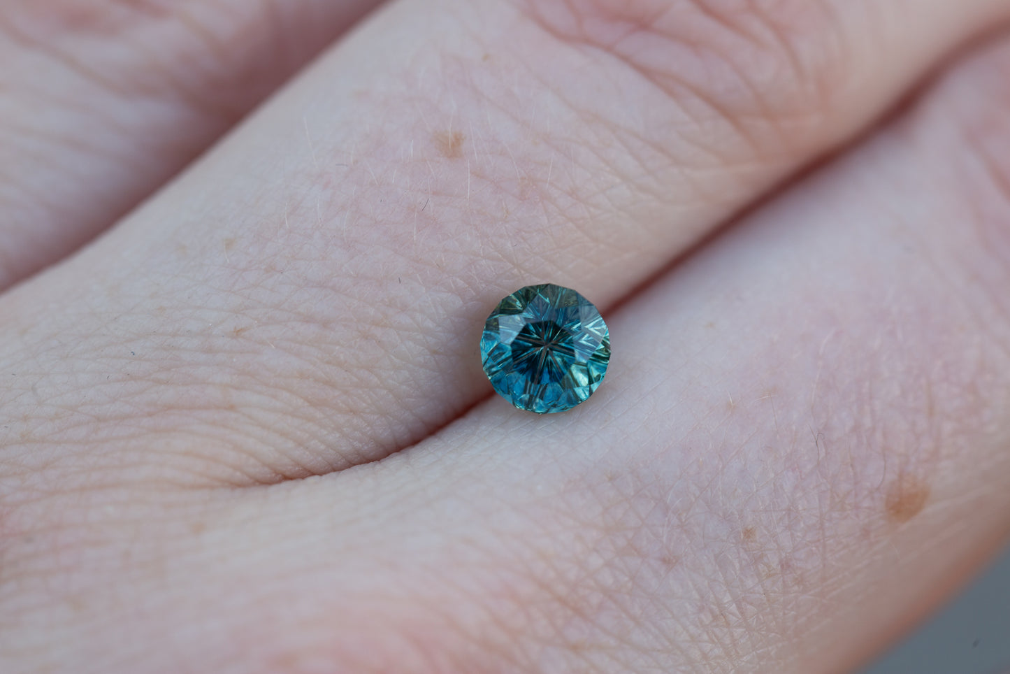 1.23ct round teal sapphire - Starbrite cut by John Dyer