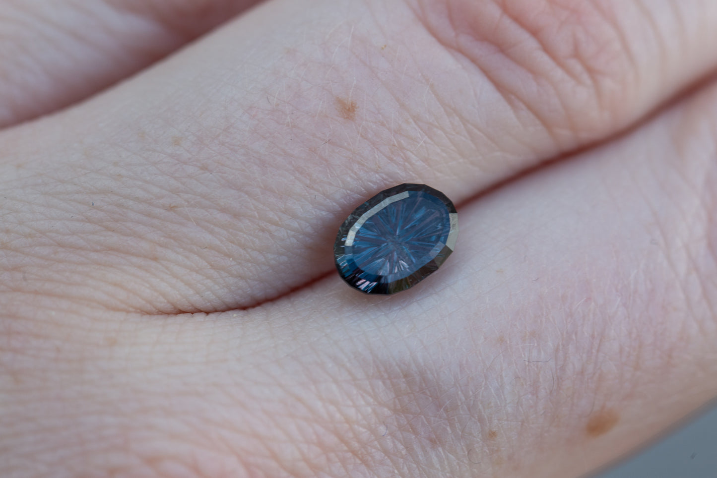1.69ct oval deep purple to blue sapphire - Starbrite cut by John Dyer