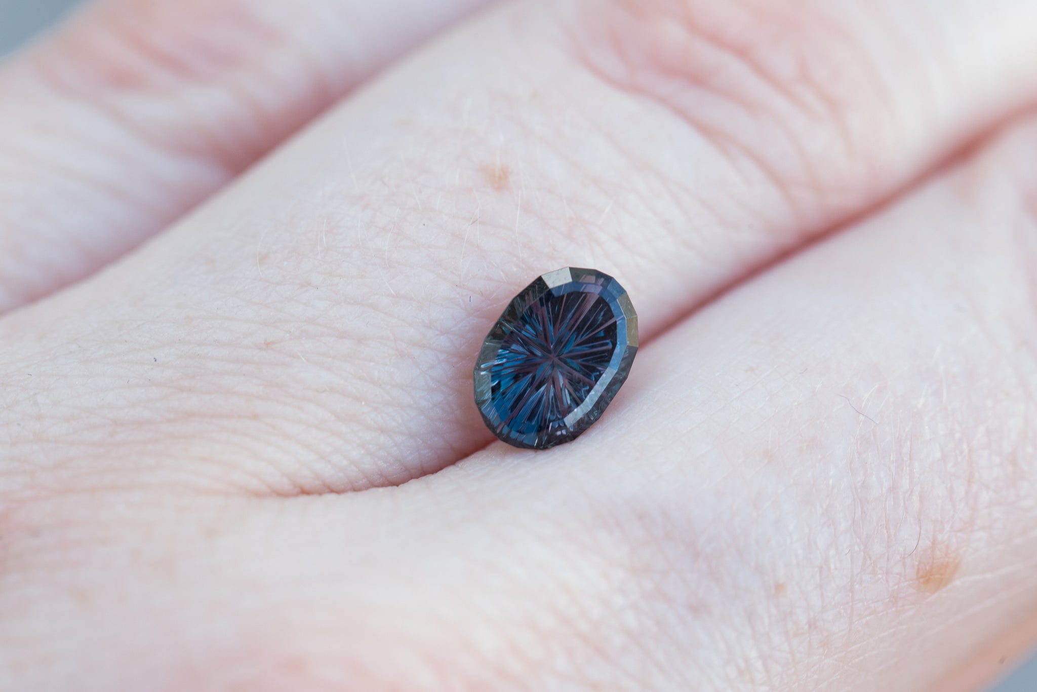 1.69ct oval deep purple to blue sapphire - Starbrite cut by John