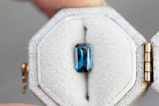 .94ct emerald cut darker blue sapphire