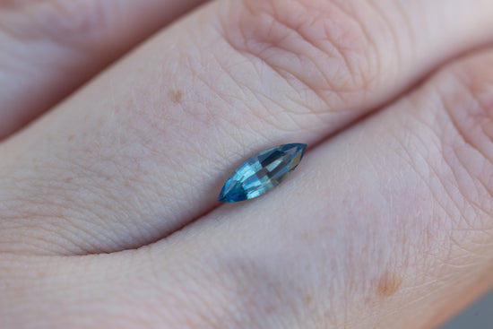 Load image into Gallery viewer, .62ct marquise teal blue sapphire
