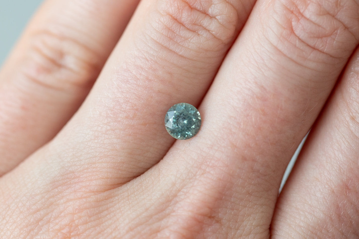 1.02ct Round Light Greenish Blue Sapphire