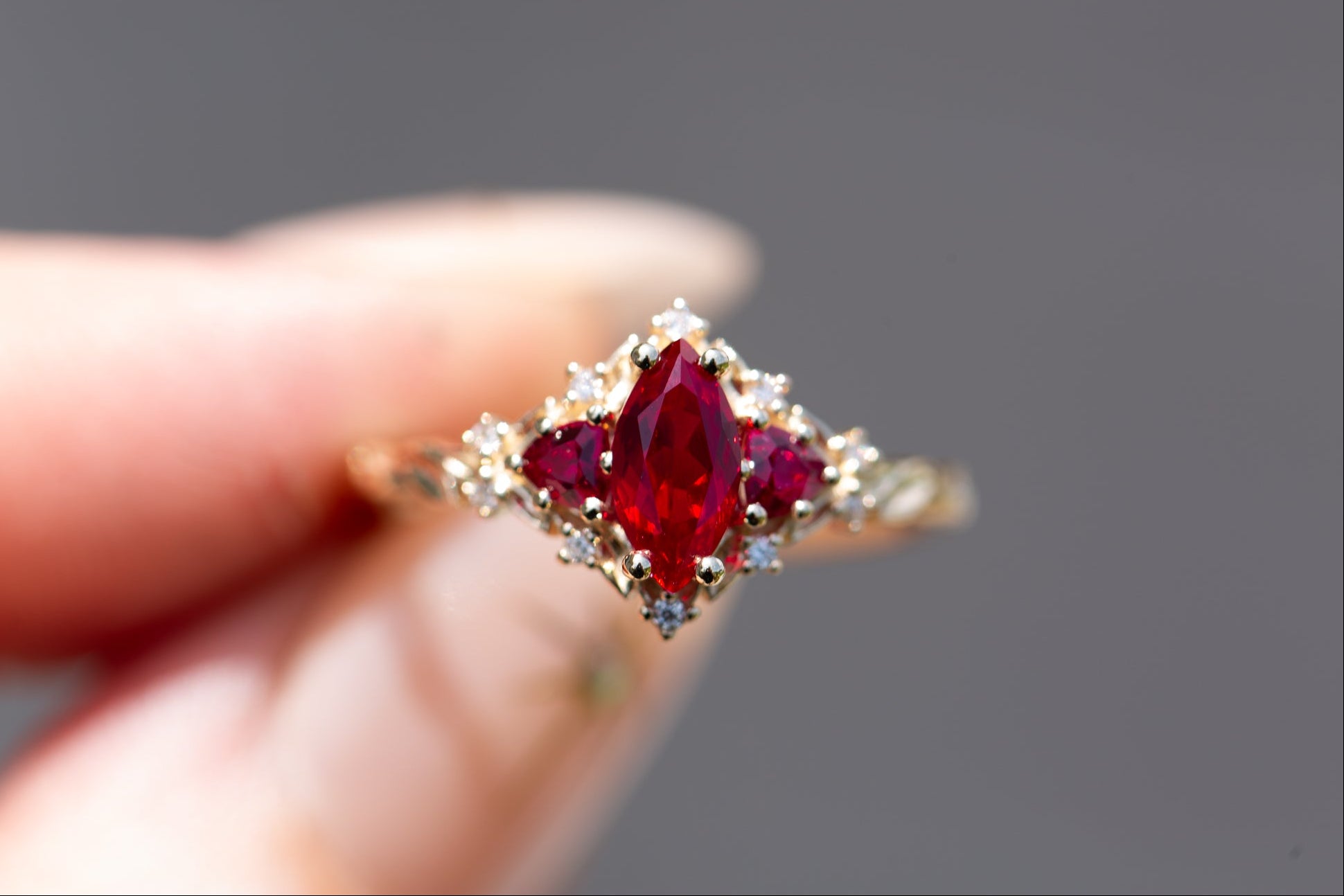 Briar Rose Three Stone with marquise lab ruby center and lab ruby