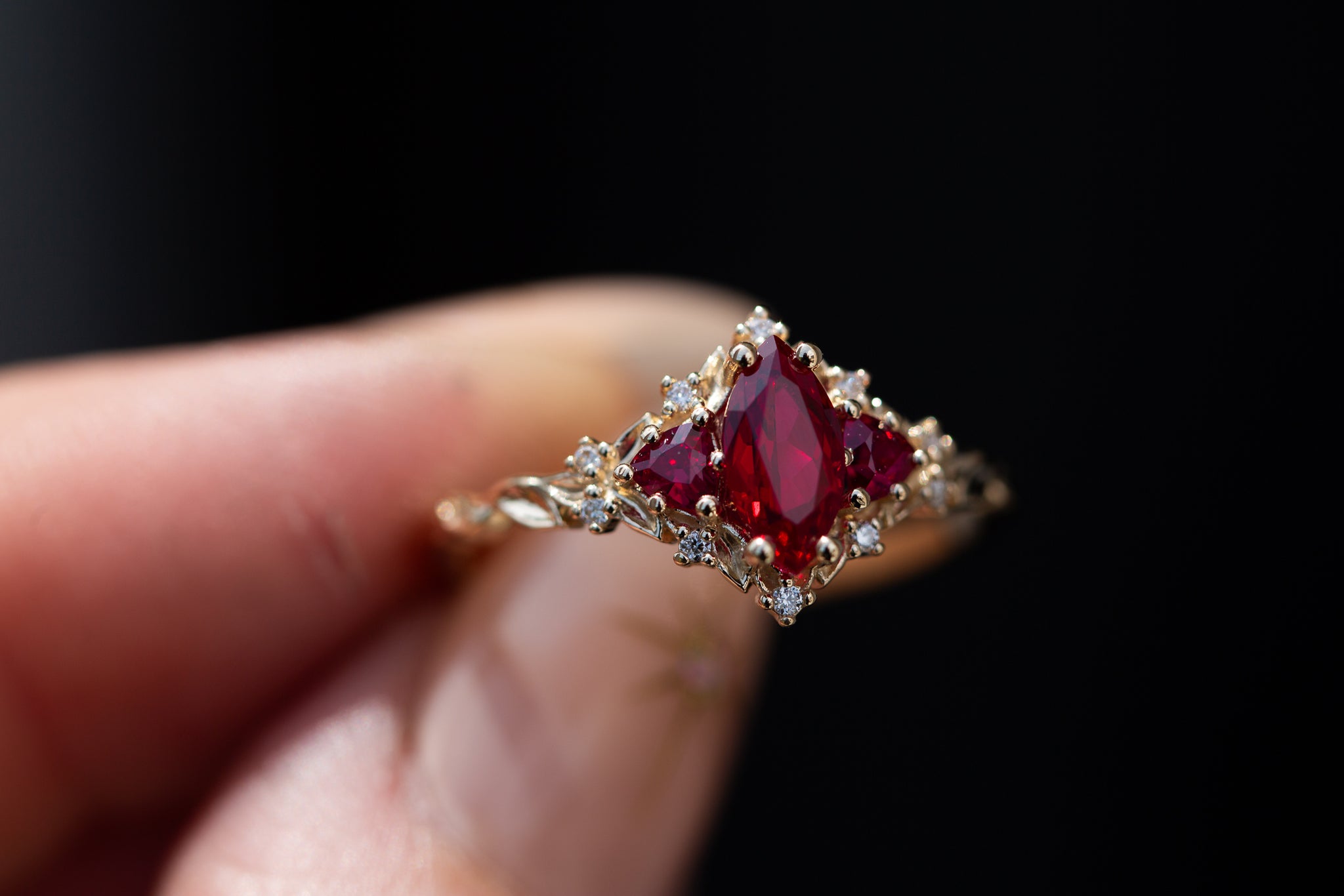 Briar Rose Three Stone with marquise lab ruby center and lab ruby