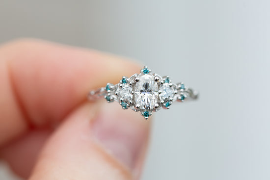 Load image into Gallery viewer, Briar rose three stone with moissanite and blue teal irradiated diamond accents
