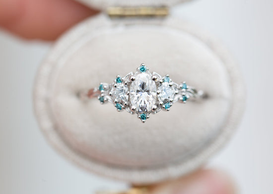 Briar rose three stone with moissanite and blue teal irradiated diamond accents