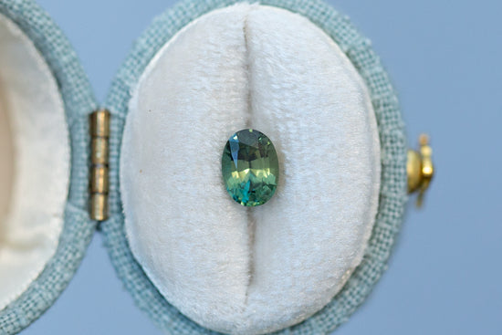 1.02ct Oval Yellowish Green Teal Sapphire