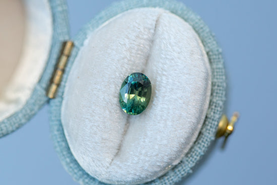 1.02ct Oval Yellowish Green Teal Sapphire