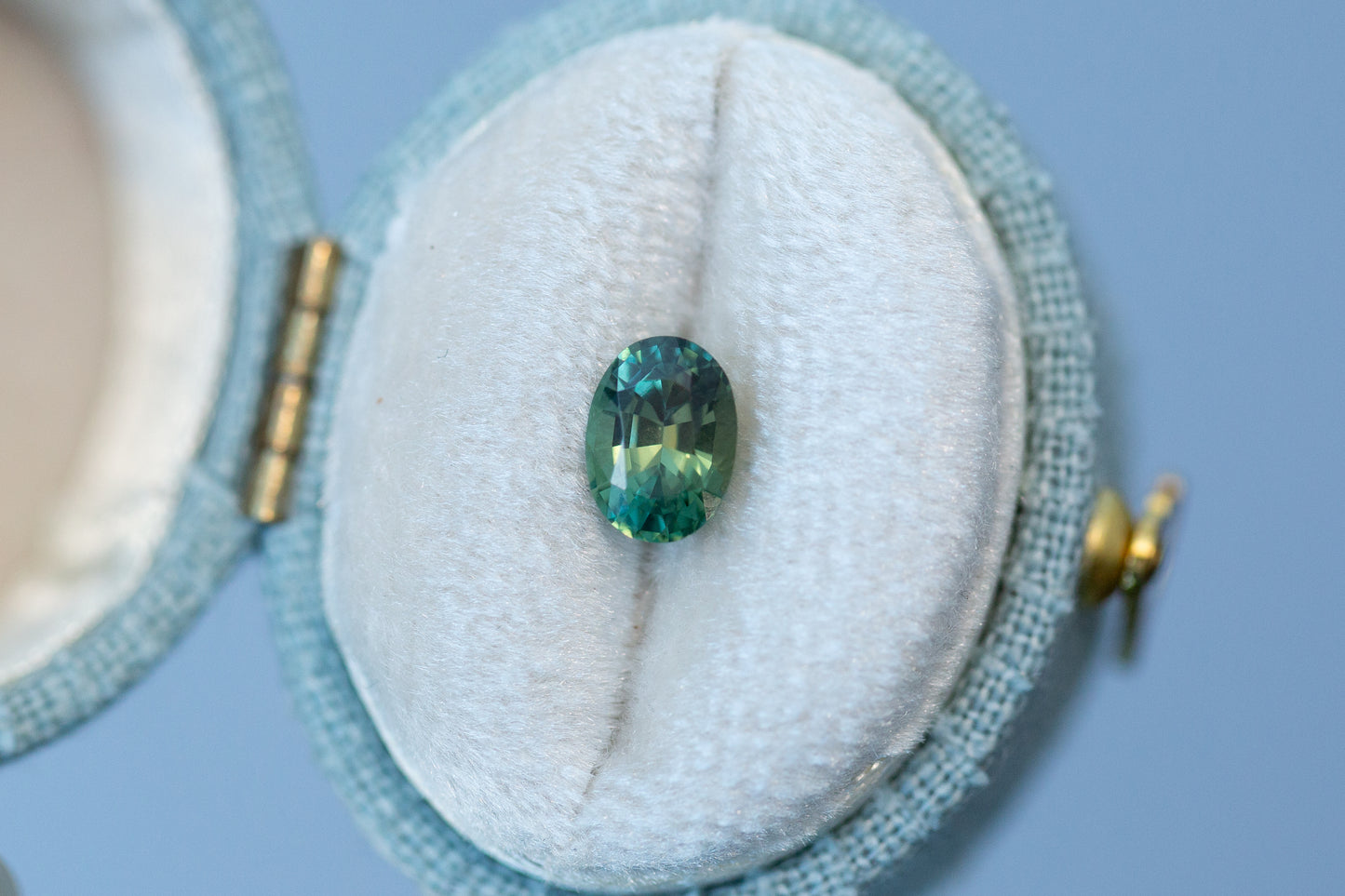 1.02ct Oval Yellowish Green Teal Sapphire