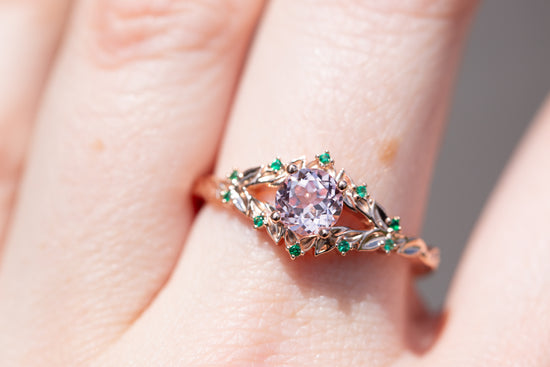 Briar rose solitaire with lab pink center and emerald accents